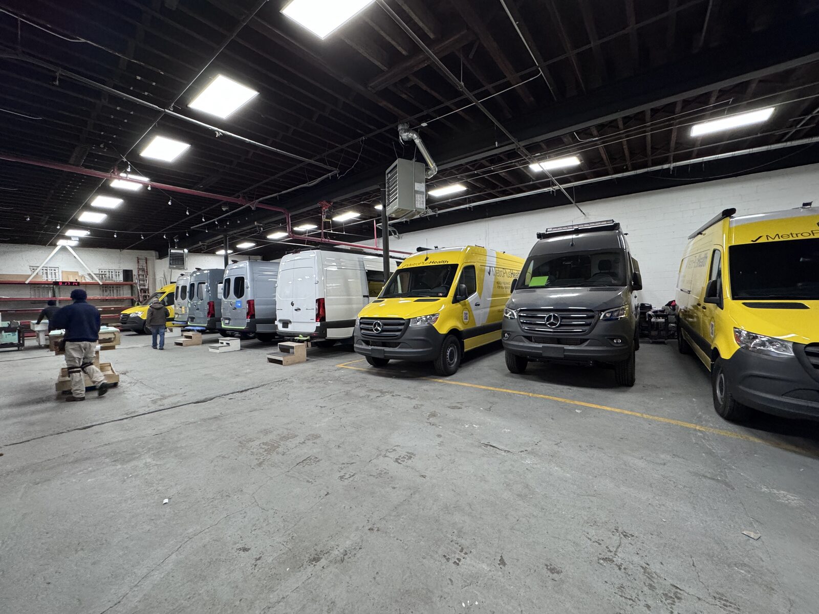 Vans lined up in production inside the Brooklyn workshop